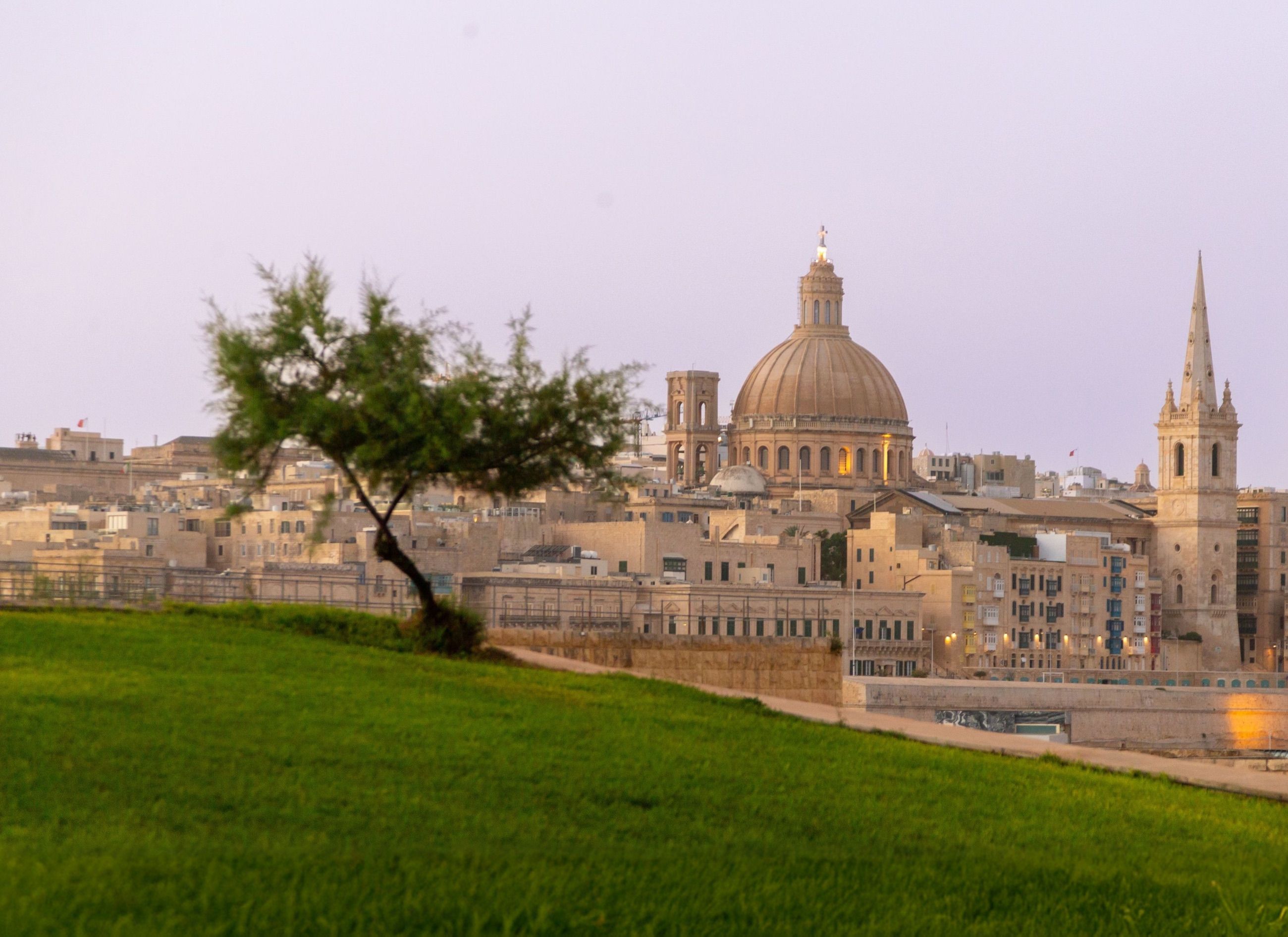 Valletta skyline at dusk with the Carmelite dome and St Paul’s spire